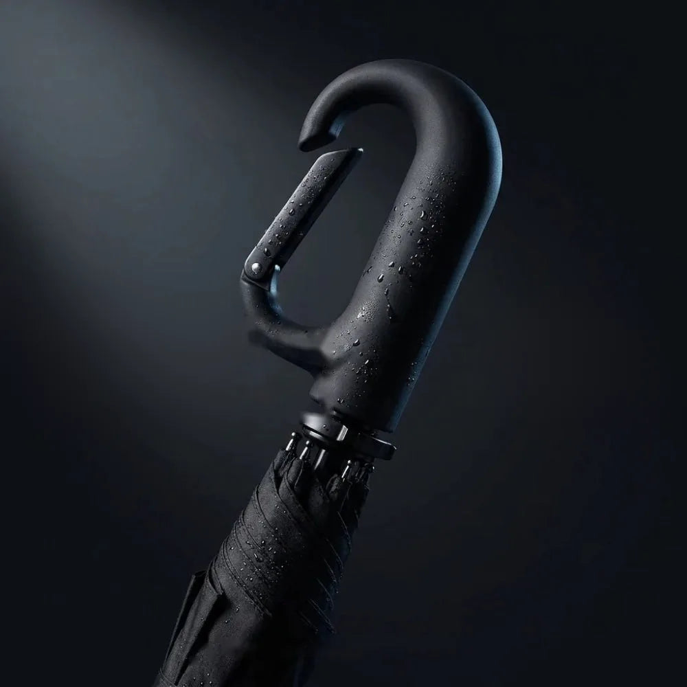 Close-up of the Umbremo hook handle covered in rain drops