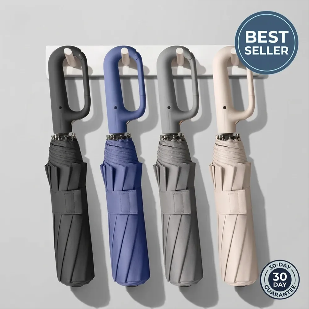 Four Umbremo umbrellas in black, blue, gray and beige hanging by their hook handles